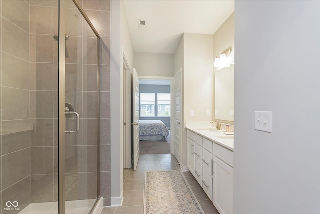 full bathroom featuring a sink, tile patterned flooring, ensuite bath, double vanity, and a stall shower