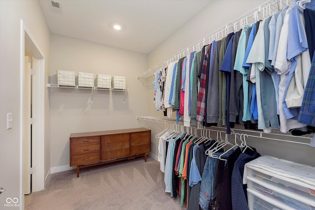 spacious closet with carpet flooring and visible vents