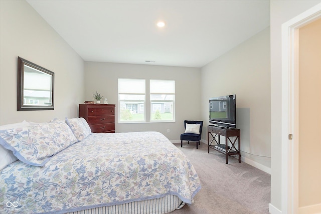 bedroom with light colored carpet, baseboards, and visible vents