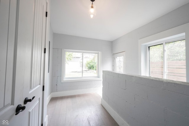 empty room with wood finished floors and baseboards