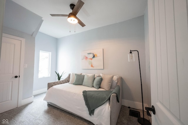 bedroom with a ceiling fan, visible vents, carpet floors, and baseboards