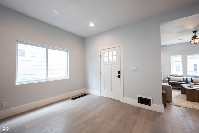 entryway with recessed lighting, wood finished floors, ceiling fan, baseboards, and visible vents