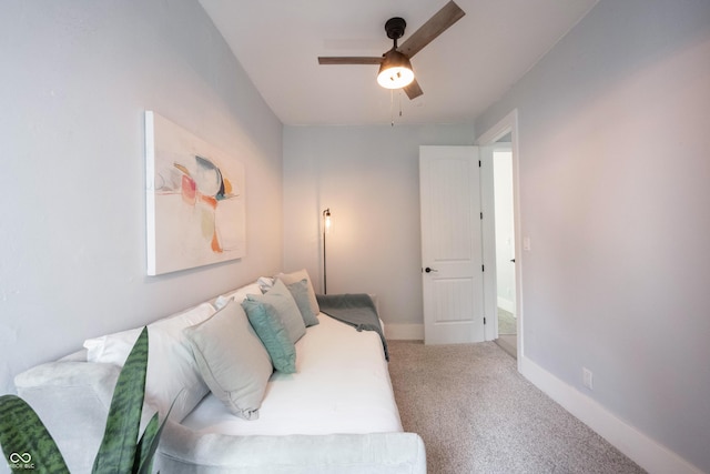 interior space with baseboards and a ceiling fan