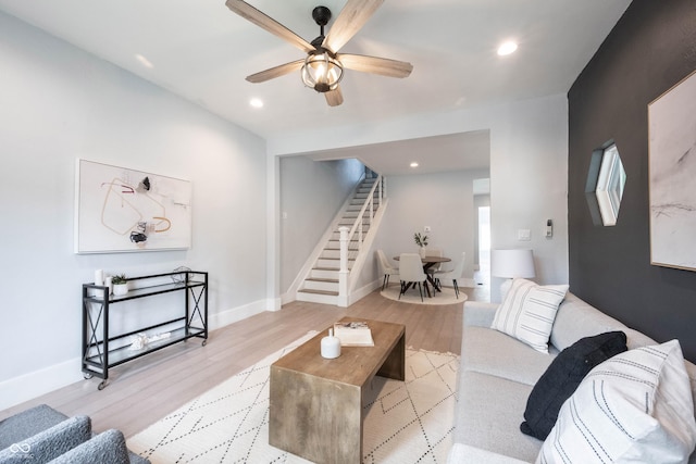 living room featuring recessed lighting, stairway, a ceiling fan, baseboards, and wood finished floors