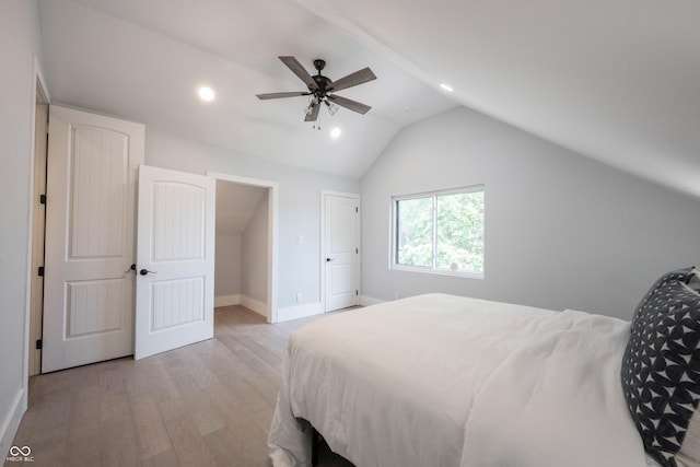 bedroom with baseboards, recessed lighting, light wood-style floors, and lofted ceiling
