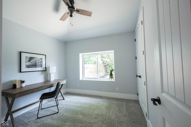 office space featuring ceiling fan, carpet flooring, and baseboards