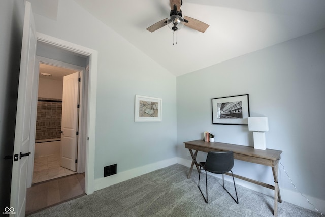 office space featuring lofted ceiling, visible vents, a ceiling fan, and baseboards