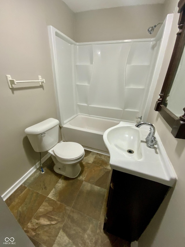 1019 E Jackson St, Shelbyville, IN 46176 - bathroom with toilet, baseboards, shower / tub combination, and vanity