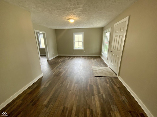 1019 E Jackson St, Shelbyville, IN 46176 - interior space with baseboards, dark wood finished floors, and a textured ceiling