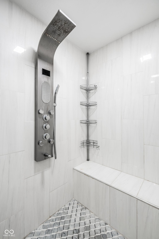 full bathroom with tiled shower