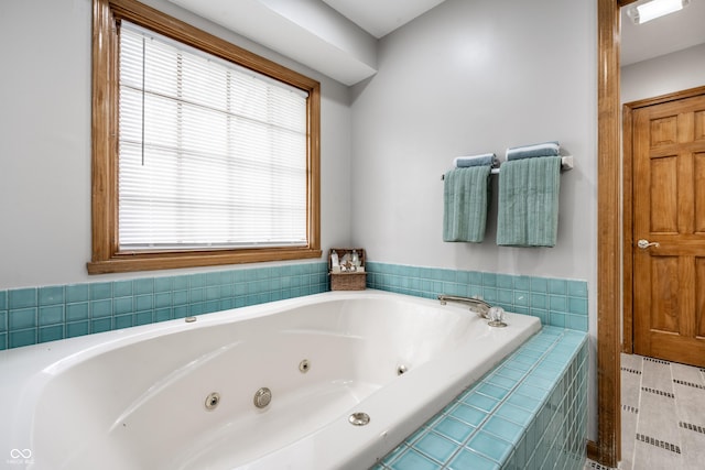 full bathroom featuring a jetted tub