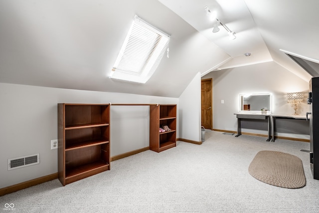 bonus room with carpet floors, baseboards, visible vents, and vaulted ceiling