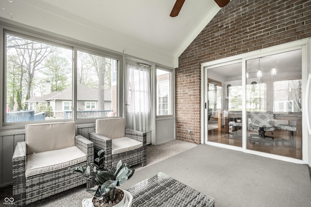 sunroom / solarium featuring ceiling fan