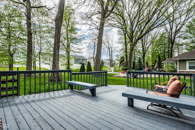 wooden terrace with a lawn and a residential view