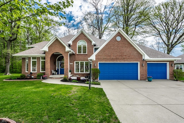 view of front facade featuring roof with shingles, an attached garage, brick siding, a front yard, and concrete driveway