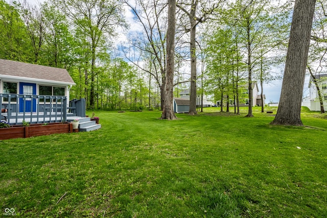 view of yard with a deck
