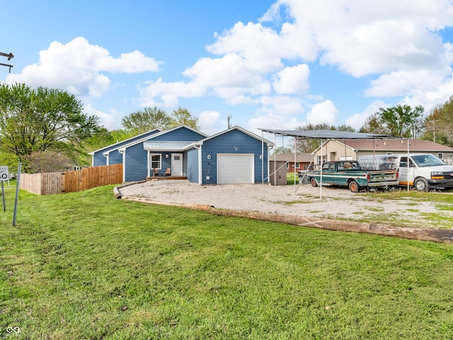 single story home featuring fence, a front lawn, driveway, and an attached garage