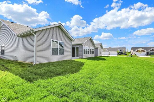110 Maxim Ct, Cumberland, IN 46229 - rear view of property with a lawn