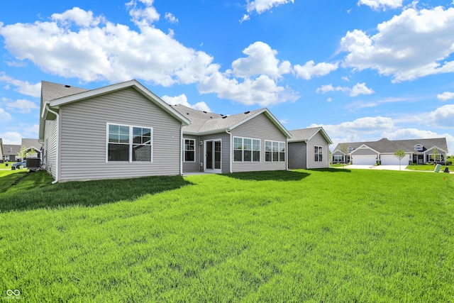 110 Maxim Ct, Cumberland, IN 46229 - back of house featuring a yard and a shingled roof