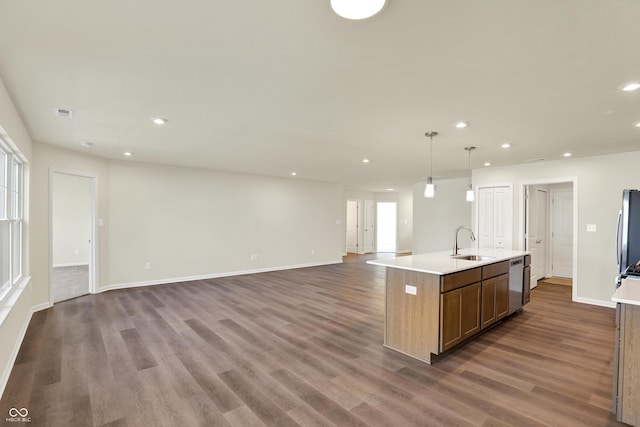 110 Maxim Ct, Cumberland, IN 46229 - kitchen with a kitchen island with sink, open floor plan, recessed lighting, a sink, and stainless steel appliances