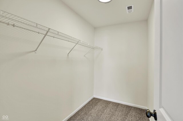 110 Maxim Ct, Cumberland, IN 46229 - walk in closet featuring visible vents and carpet
