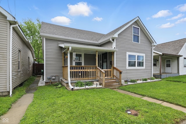 842 Miller Ave, Shelbyville, IN 46176 - view of front of home featuring roof with shingles, a porch, and a front lawn