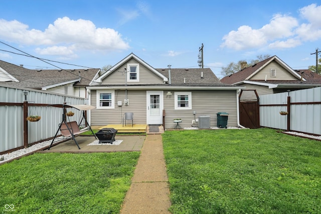842 Miller Ave, Shelbyville, IN 46176 - rear view of house with a patio, a fenced backyard, a gate, a lawn, and an outdoor fire pit