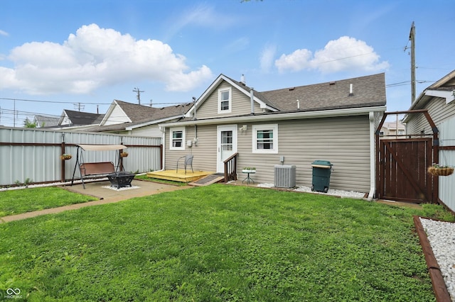 842 Miller Ave, Shelbyville, IN 46176 - back of property with a lawn, a gate, fence, and a shingled roof