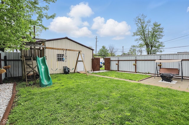 842 Miller Ave, Shelbyville, IN 46176 - view of yard featuring a playground, fence, a patio, and a fire pit