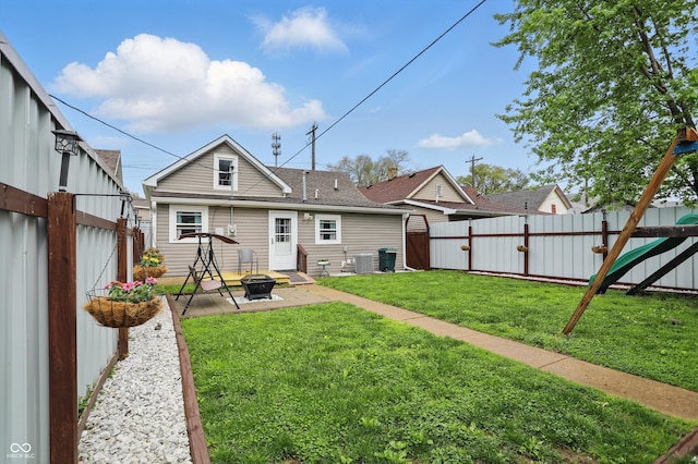 842 Miller Ave, Shelbyville, IN 46176 - back of property with a gate, central air condition unit, a fenced backyard, a patio, and a fire pit