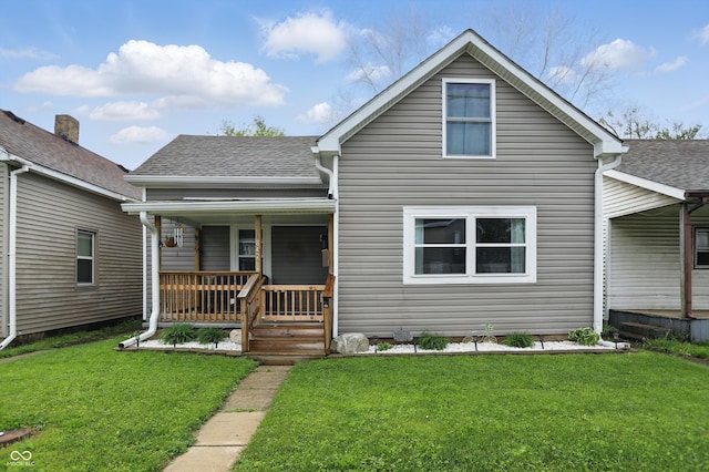 842 Miller Ave, Shelbyville, IN 46176 - bungalow-style house with covered porch, a shingled roof, and a front yard