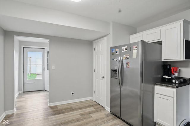 842 Miller Ave, Shelbyville, IN 46176 - kitchen featuring light wood-type flooring, white cabinetry, dark countertops, and stainless steel fridge with ice dispenser