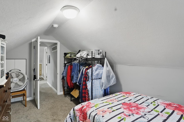 842 Miller Ave, Shelbyville, IN 46176 - carpeted bedroom with baseboards, a textured ceiling, vaulted ceiling, and visible vents