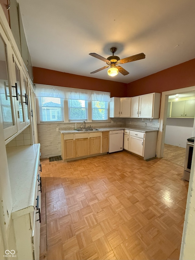 kitchen featuring range, a sink, ceiling fan, light countertops, and dishwasher