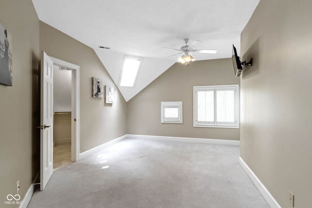 10919 Running Tide Ct, Indianapolis, IN 46236 - additional living space featuring a ceiling fan, carpet flooring, vaulted ceiling, and baseboards