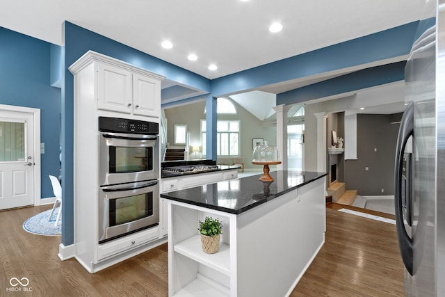 10919 Running Tide Ct, Indianapolis, IN 46236 - kitchen featuring stainless steel appliances, white cabinetry, a center island, dark wood-style floors, and open shelves
