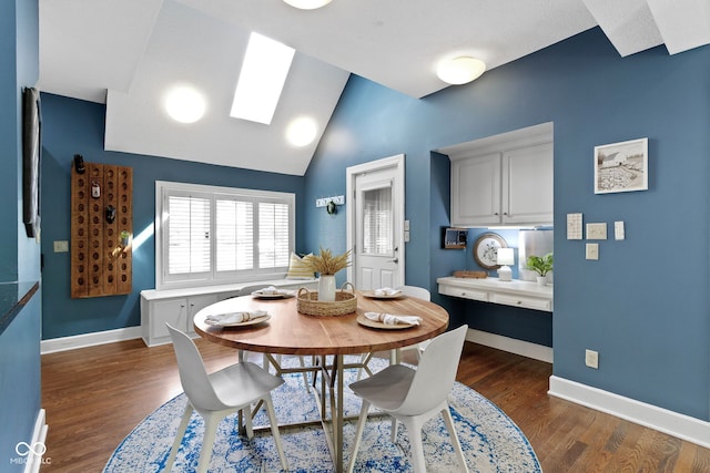 10919 Running Tide Ct, Indianapolis, IN 46236 - dining space featuring dark wood-type flooring, baseboards, a skylight, and vaulted ceiling
