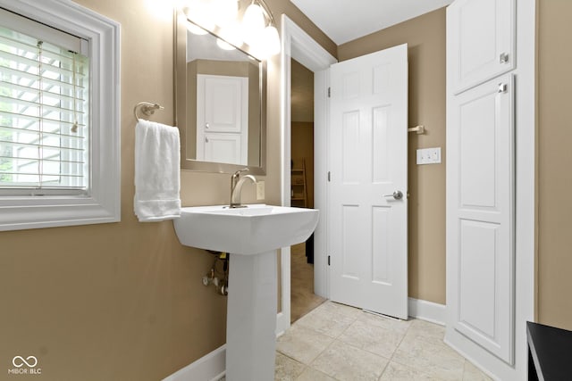 10919 Running Tide Ct, Indianapolis, IN 46236 - bathroom with baseboards and tile patterned flooring