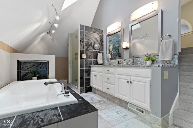 10919 Running Tide Ct, Indianapolis, IN 46236 - bathroom with vaulted ceiling, double vanity, a shower stall, a bath, and marble finish floors