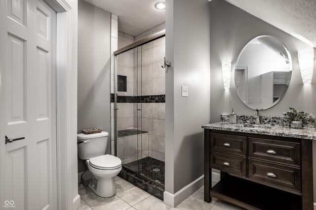 10919 Running Tide Ct, Indianapolis, IN 46236 - full bath featuring a textured ceiling, vanity, a shower stall, toilet, and baseboards