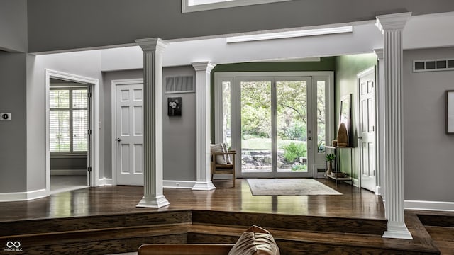10919 Running Tide Ct, Indianapolis, IN 46236 - entrance foyer with ornate columns, wood finished floors, and baseboards