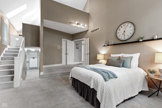10919 Running Tide Ct, Indianapolis, IN 46236 - carpeted bedroom featuring baseboards, a towering ceiling, and a skylight