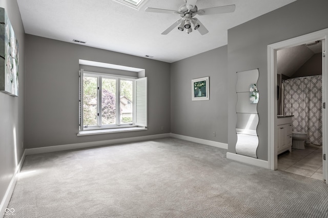 10919 Running Tide Ct, Indianapolis, IN 46236 - unfurnished bedroom featuring light carpet, baseboards, ensuite bath, and a ceiling fan