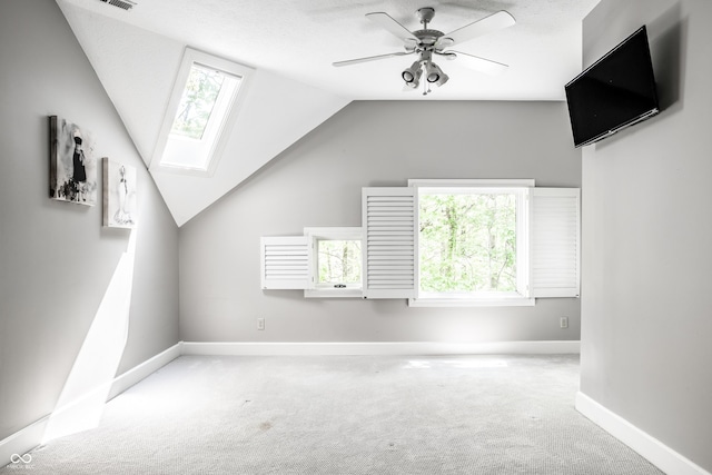 10919 Running Tide Ct, Indianapolis, IN 46236 - additional living space with carpet flooring, a skylight, lofted ceiling, and ceiling fan