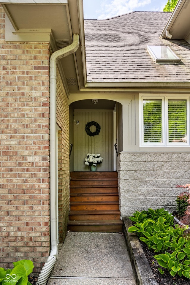 10919 Running Tide Ct, Indianapolis, IN 46236 - view of exterior entry with a shingled roof and brick siding