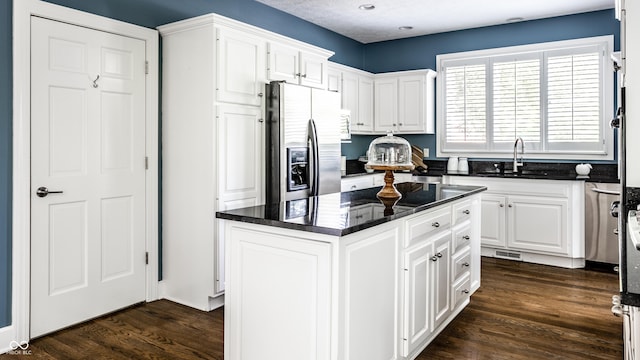 10919 Running Tide Ct, Indianapolis, IN 46236 - kitchen featuring stainless steel fridge, white cabinets, dark wood-type flooring, a kitchen island, and recessed lighting
