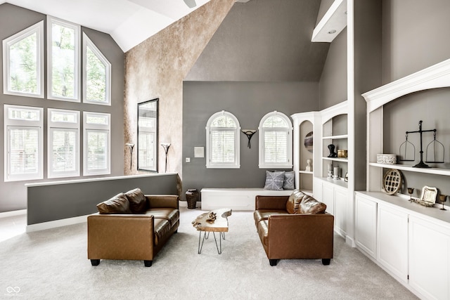 10919 Running Tide Ct, Indianapolis, IN 46236 - living room with high vaulted ceiling, light colored carpet, and built in features
