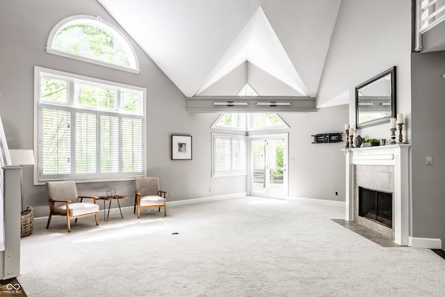 10919 Running Tide Ct, Indianapolis, IN 46236 - living area with high vaulted ceiling, carpet, a tile fireplace, and plenty of natural light