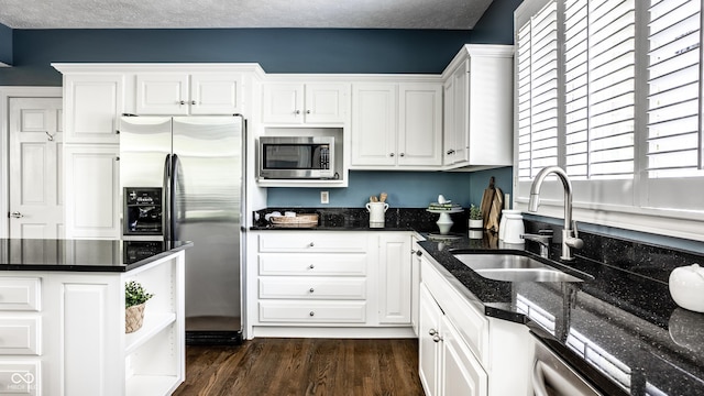 10919 Running Tide Ct, Indianapolis, IN 46236 - kitchen with stainless steel appliances, white cabinets, dark wood finished floors, and dark stone counters