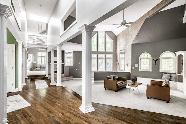 10919 Running Tide Ct, Indianapolis, IN 46236 - living area featuring ornate columns, high vaulted ceiling, ceiling fan, and wood finished floors
